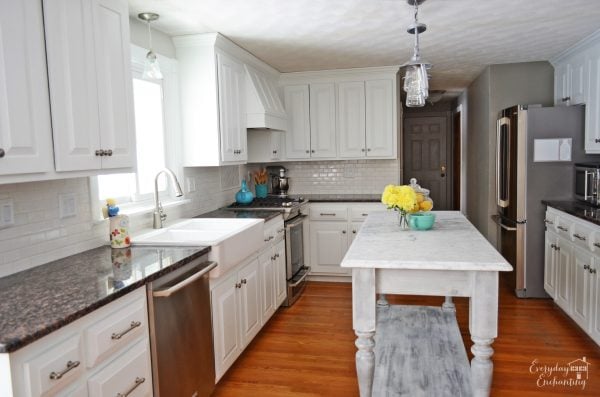 marble kitchen island in white kitchen, Everyday Enchanting on Remodelaholic