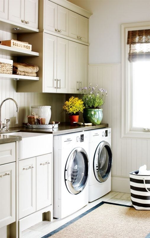 Beautiful millwork and cabinetry laundry room featured on Remodelaholic.com