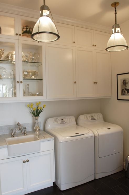 Tall ceilings laundry room with fancy touches featured on Remodelaholic.com 