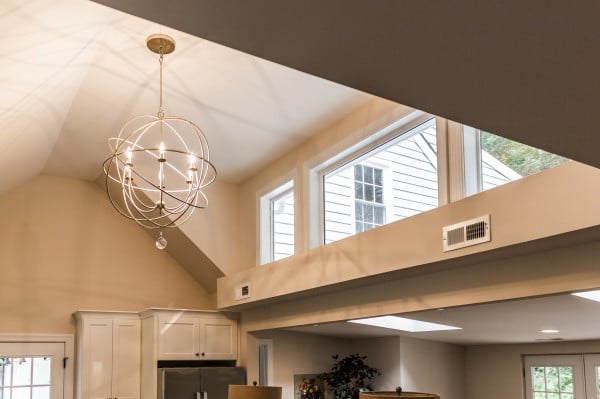 5 orb chandelier in open kitchen and dining with high ceilings, Cobblestone DG on Remodelaholic