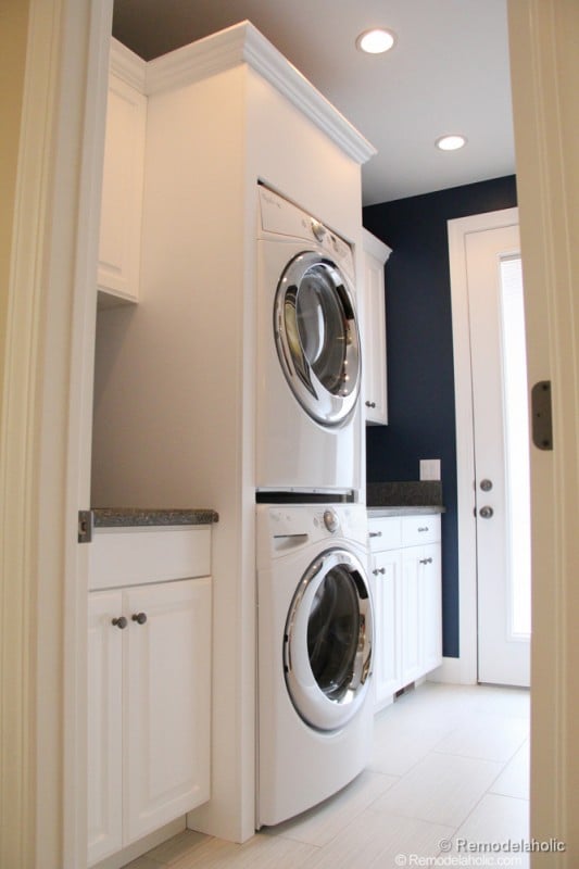 Make room for counter space with stacked washer and dryer. Fabulous Laundry room design ideas from @Remodelaholic 